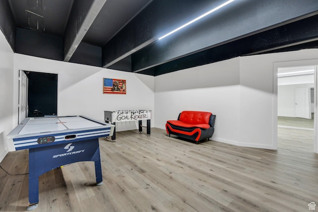 game room with wood finished floors and baseboards