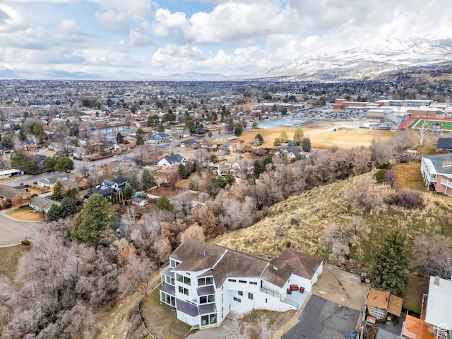 birds eye view of property featuring a mountain view