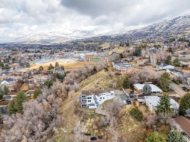drone / aerial view featuring a residential view and a mountain view