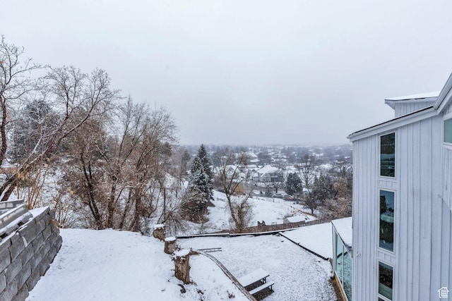 view of yard layered in snow