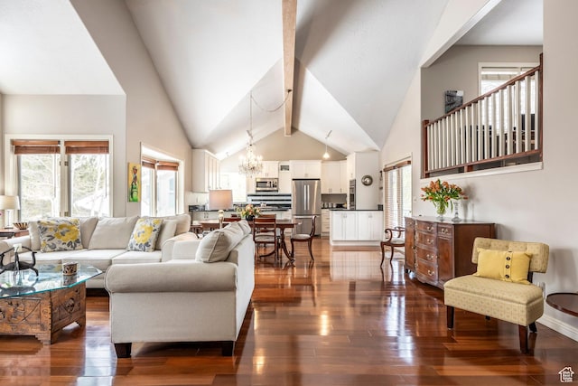 1494 W Meadow Loop Rd, Park City, UT 84098 - living area with a notable chandelier, high vaulted ceiling, plenty of natural light, and dark wood finished floors