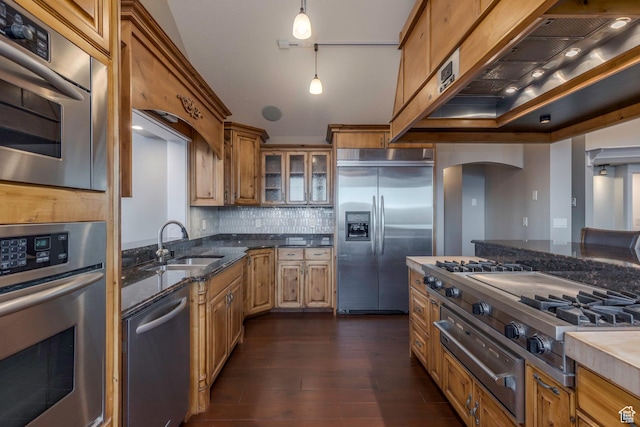 2008 N 3850 E, Eden, UT 84310 - kitchen featuring a sink, arched walkways, dark wood finished floors, stainless steel appliances, and a warming drawer