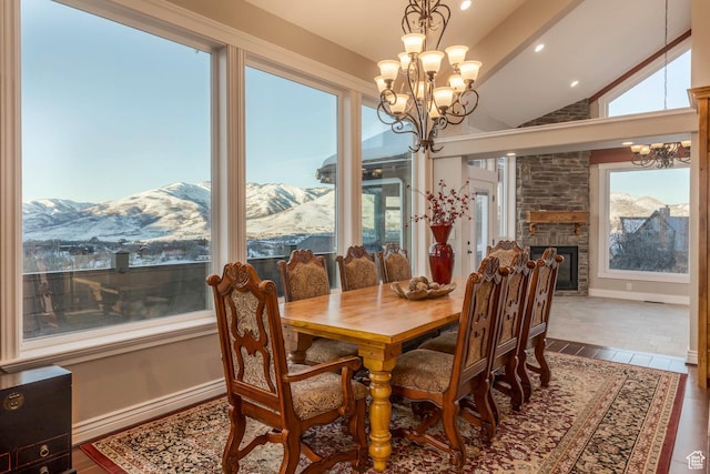 2008 N 3850 E, Eden, UT 84310 - dining space featuring a stone fireplace, a mountain view, lofted ceiling, and a notable chandelier