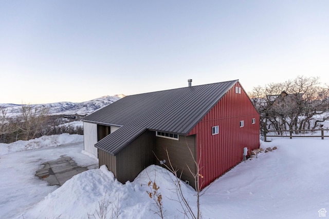 2008 N 3850 E, Eden, UT 84310 - snow covered property featuring an outdoor structure, a garage, a pole building, metal roof, and a mountain view