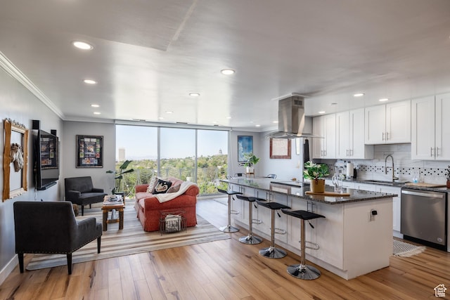 777 E S Temple S Unit 11F, Salt Lake City, UT 84102 - kitchen with dishwasher, a sink, island range hood, a kitchen bar, and white cabinets