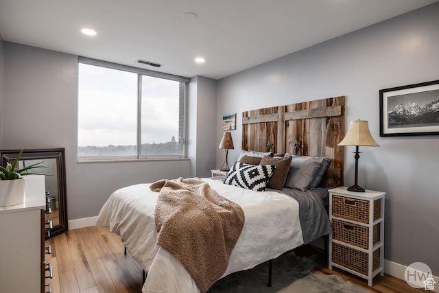 777 E S Temple S Unit 11F, Salt Lake City, UT 84102 - bedroom featuring baseboards, wood finished floors, and recessed lighting