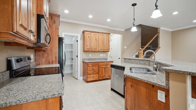 kitchen featuring pendant lighting, stainless steel appliances, ornamental molding, and a sink