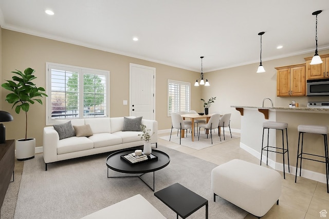 930 N 980 W, Orem, UT 84057 - living area with light tile patterned flooring, plenty of natural light, crown molding, baseboards, and recessed lighting