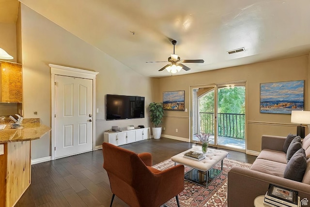 581 S 2220 W Unit 301, Pleasant Grove, UT 84062 - living room with dark wood-style floors, lofted ceiling, visible vents, a ceiling fan, and baseboards