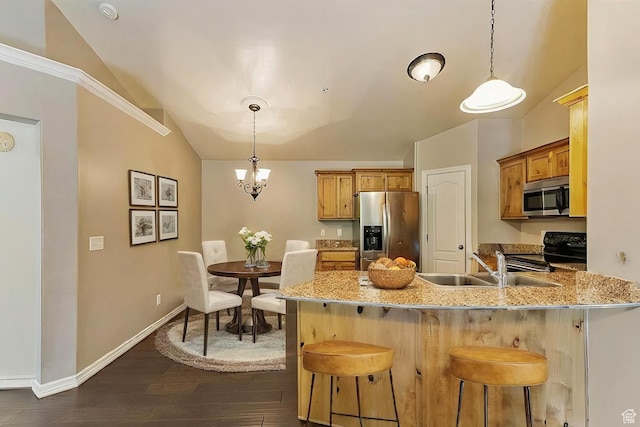 581 S 2220 W Unit 301, Pleasant Grove, UT 84062 - kitchen with lofted ceiling, stainless steel appliances, a peninsula, and a kitchen bar