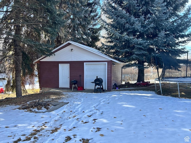 162 S 3 E, Preston, ID 83263 - snow covered garage featuring a trampoline