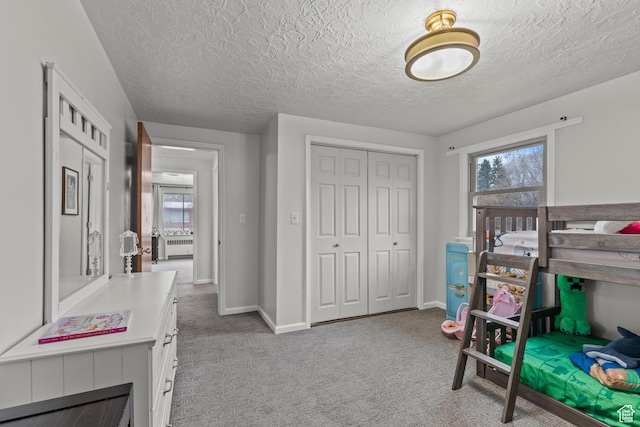 162 S 3 E, Preston, ID 83263 - carpeted bedroom featuring radiator, baseboards, a closet, and a textured ceiling