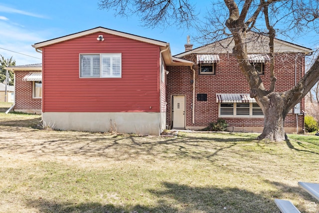 162 S 3 E, Preston, ID 83263 - view of front of house featuring brick siding and a front lawn
