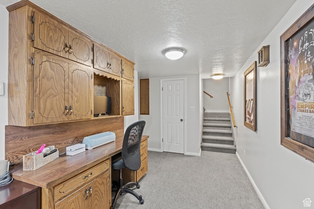 162 S 3 E, Preston, ID 83263 - office area featuring built in desk, light carpet, baseboards, and a textured ceiling
