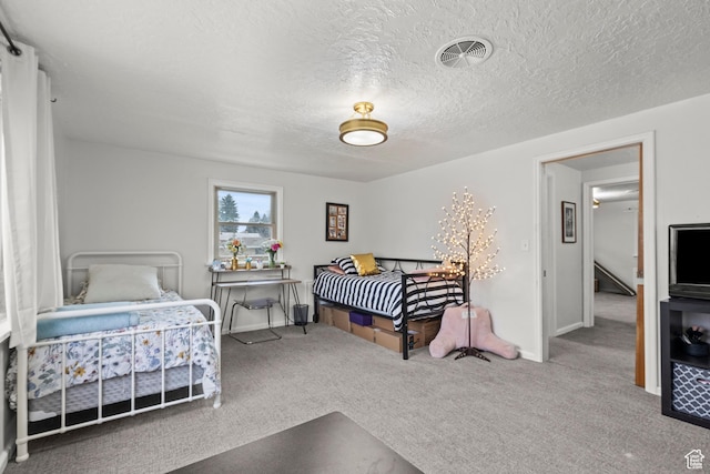 162 S 3 E, Preston, ID 83263 - carpeted bedroom with a textured ceiling, baseboards, and visible vents