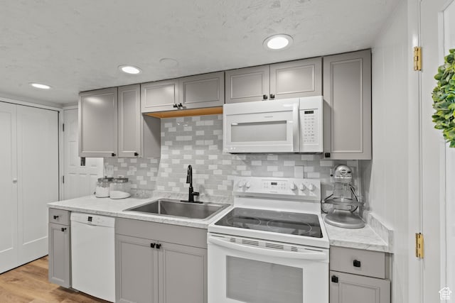 162 S 3 E, Preston, ID 83263 - kitchen with white appliances, gray cabinetry, a sink, and tasteful backsplash