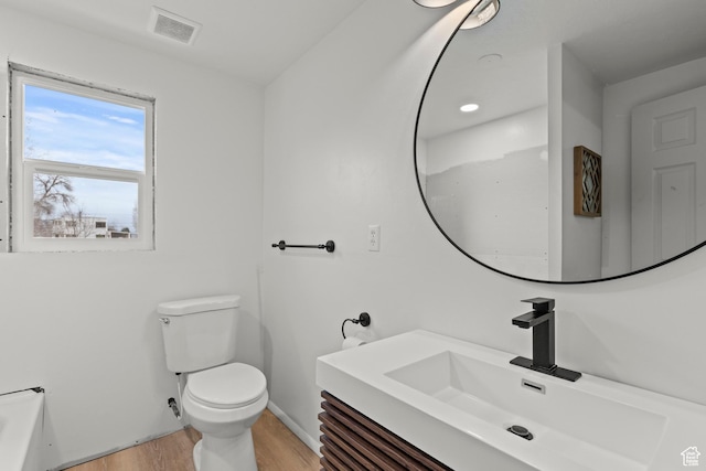 162 S 3 E, Preston, ID 83263 - bathroom featuring toilet, vanity, wood finished floors, baseboards, and visible vents
