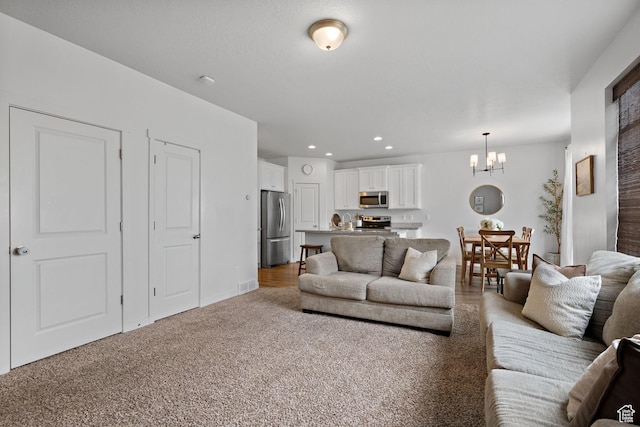 116 W Condor Rd N, Saratoga Springs, UT 84045 - living area featuring a notable chandelier, light carpet, visible vents, and recessed lighting