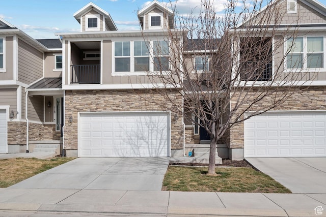 116 W Condor Rd N, Saratoga Springs, UT 84045 - view of front of house featuring stone siding, concrete driveway, a balcony, and an attached garage
