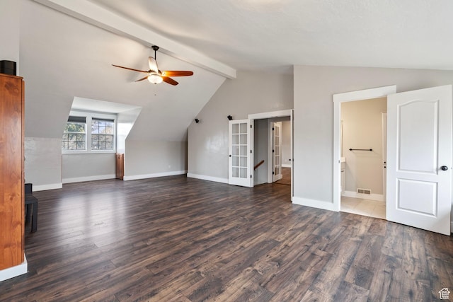 additional living space featuring vaulted ceiling with beams, wood finished floors, a ceiling fan, and baseboards