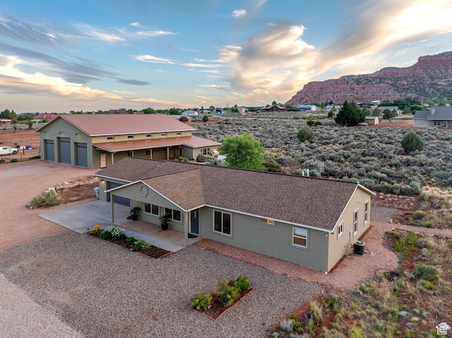 birds eye view of property with a mountain view