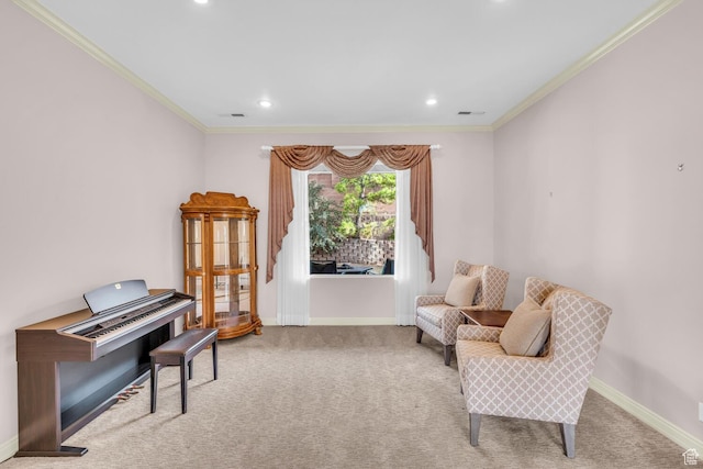 sitting room featuring baseboards, visible vents, carpet, and ornamental molding