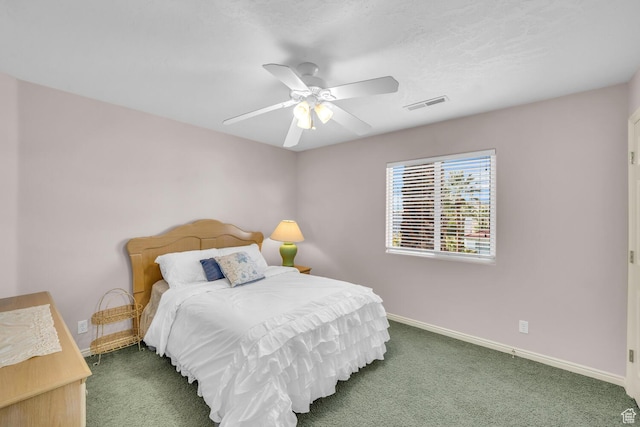 carpeted bedroom featuring ceiling fan, baseboards, and visible vents