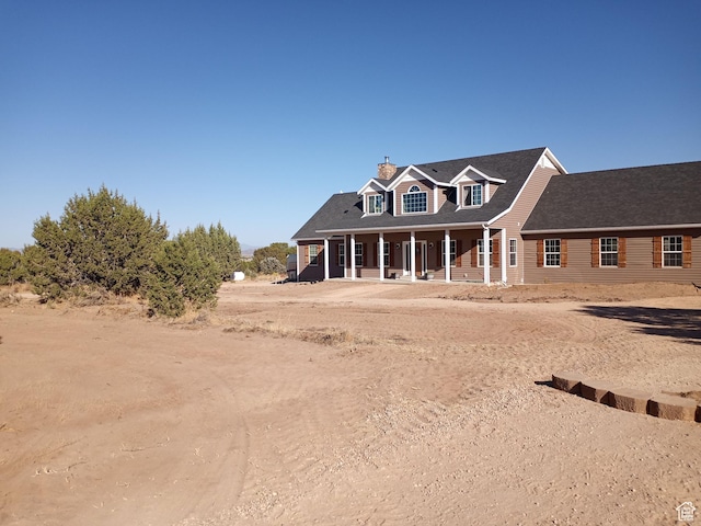 4680 N 4500 W, Cedar City, UT 84721 - new england style home featuring covered porch and a chimney
