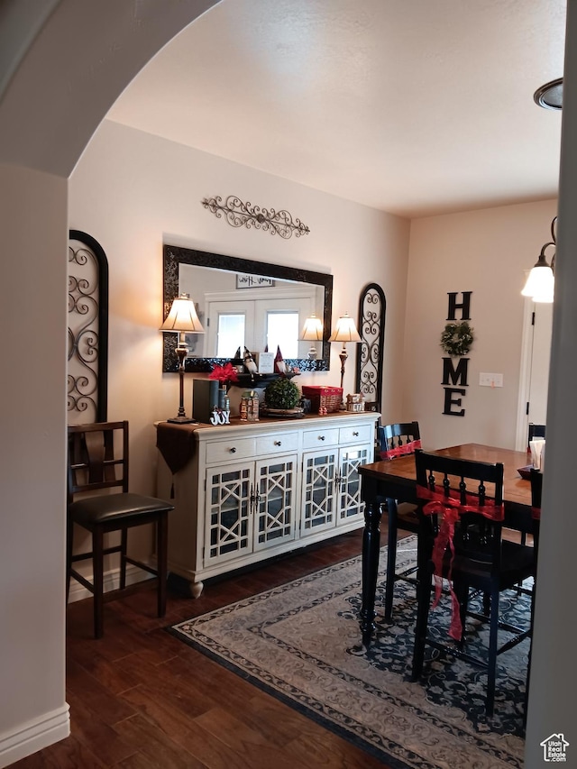 4680 N 4500 W, Cedar City, UT 84721 - dining room featuring dark wood-style floors, arched walkways, and baseboards