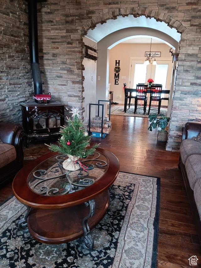 4680 N 4500 W, Cedar City, UT 84721 - living area with arched walkways, wood finished floors, and a wood stove