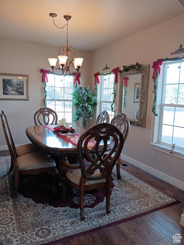 4680 N 4500 W, Cedar City, UT 84721 - dining space featuring a notable chandelier, baseboards, wood finished floors, and a healthy amount of sunlight