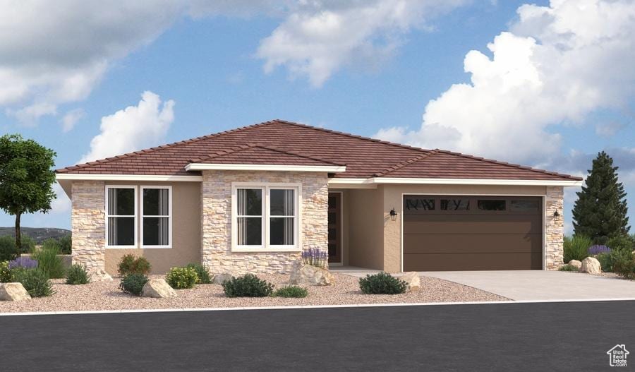 635 S 230 W Unit 5, Ivins, UT 84738 - view of front of home with an attached garage, stone siding, driveway, and stucco siding
