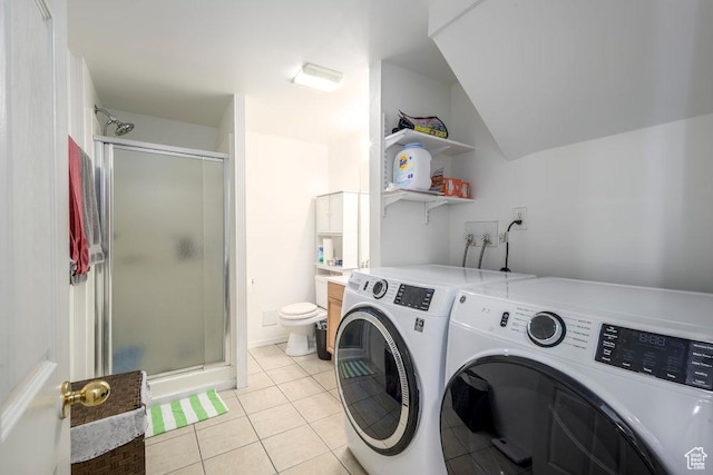 washroom with laundry area, light tile patterned flooring, and independent washer and dryer