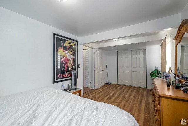 bedroom with wood finished floors