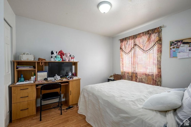 bedroom featuring light wood finished floors