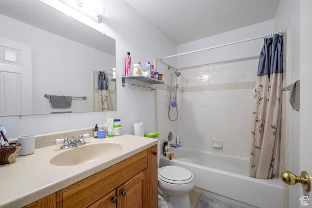 bathroom featuring toilet, shower / bath combo with shower curtain, and vanity