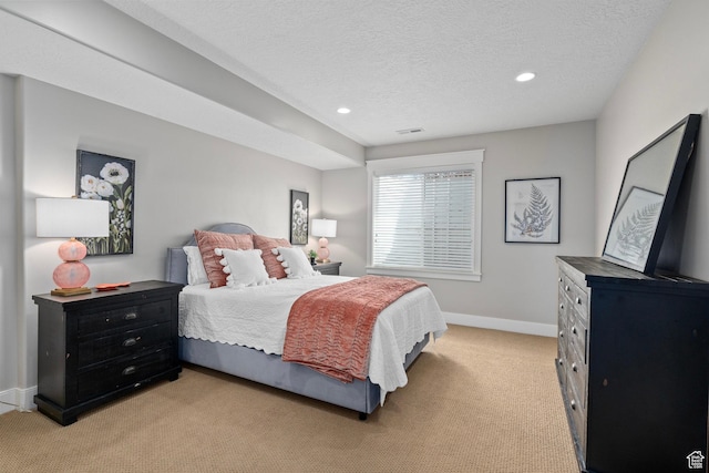 bedroom featuring light colored carpet, baseboards, recessed lighting, and a textured ceiling