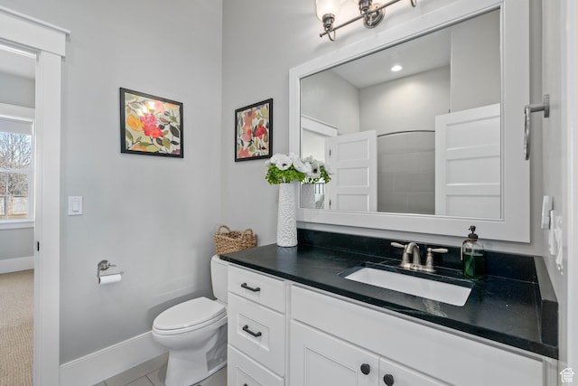full bathroom with baseboards, toilet, vanity, and tile patterned floors