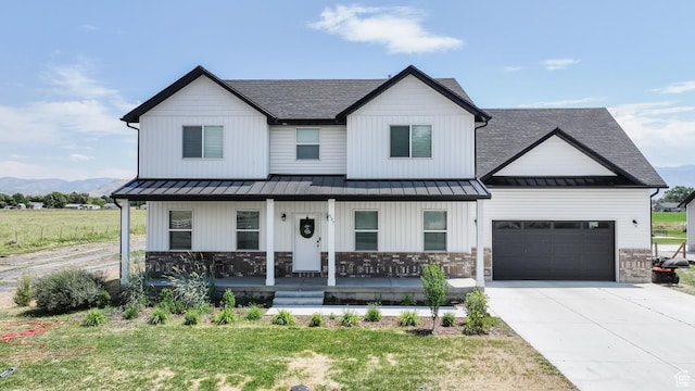 637 S 4th W, Preston, ID 83263 - modern farmhouse style home with a standing seam roof, covered porch, a shingled roof, an attached garage, and concrete driveway