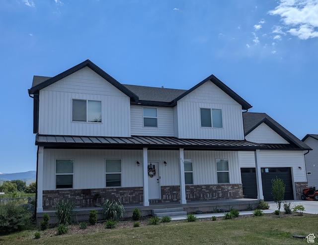 637 S 4th W, Preston, ID 83263 - view of front of property with a standing seam roof, covered porch, a garage, and metal roof