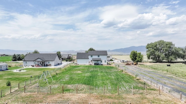 637 S 4th W, Preston, ID 83263 - fenced backyard with dirt driveway, a view of rural / pastoral area, a mountain view, and a garage