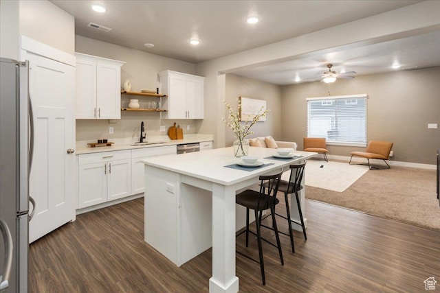 1704 E Talon Way, Eagle Mountain, UT 84005 - kitchen featuring appliances with stainless steel finishes, a sink, light countertops, open floor plan, and visible vents