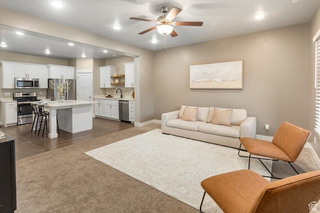 1704 E Talon Way, Eagle Mountain, UT 84005 - living room featuring recessed lighting, a ceiling fan, baseboards, and dark carpet