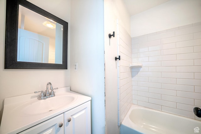 bathroom featuring shower / washtub combination and vanity