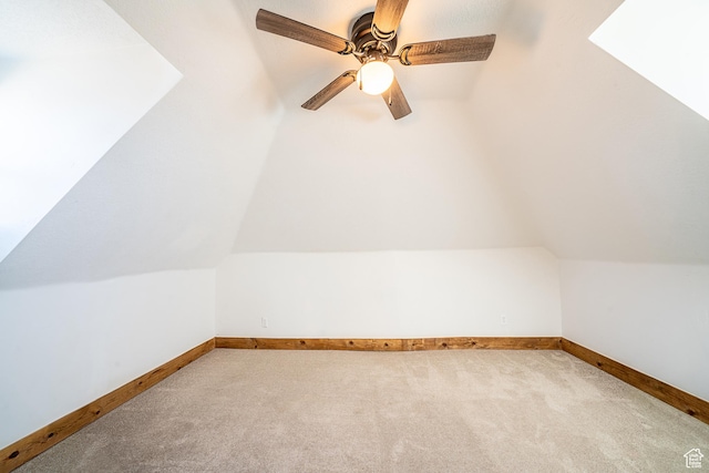 bonus room featuring vaulted ceiling, ceiling fan, carpet flooring, and baseboards