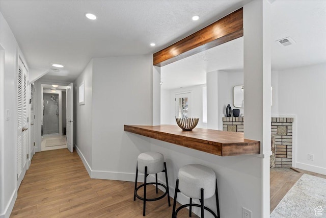 251 N Center St W, Salt Lake City, UT 84103 - interior space with baseboards, beam ceiling, visible vents, and light wood-style floors
