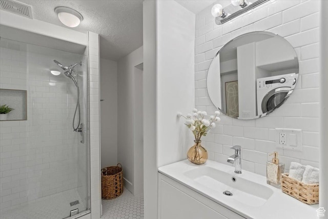 251 N Center St W, Salt Lake City, UT 84103 - bathroom with visible vents, backsplash, a stall shower, a textured ceiling, and vanity