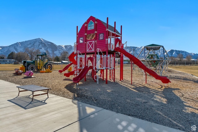 community jungle gym featuring a mountain view