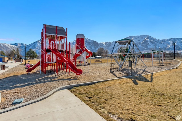 community jungle gym with a mountain view