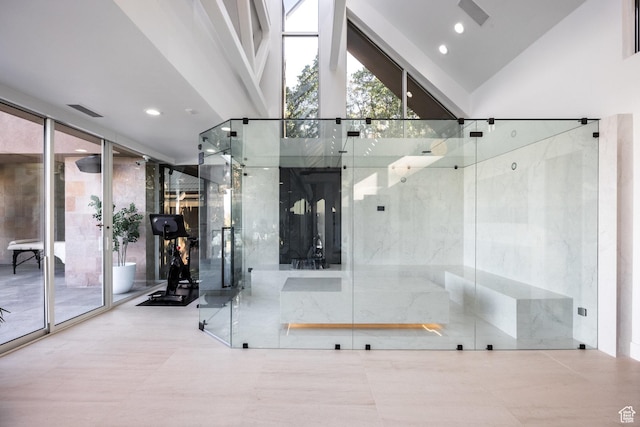 3826 E Thousand Oaks Cir, Salt Lake City, UT 84124 - bathroom with high vaulted ceiling, visible vents, a wall of windows, and recessed lighting